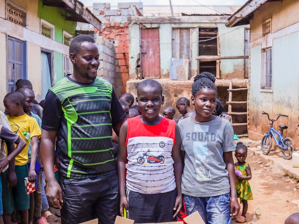 Our team member with two children in their neighbourhood