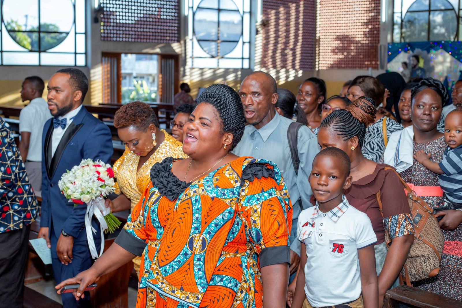A church congregation standing together during a service