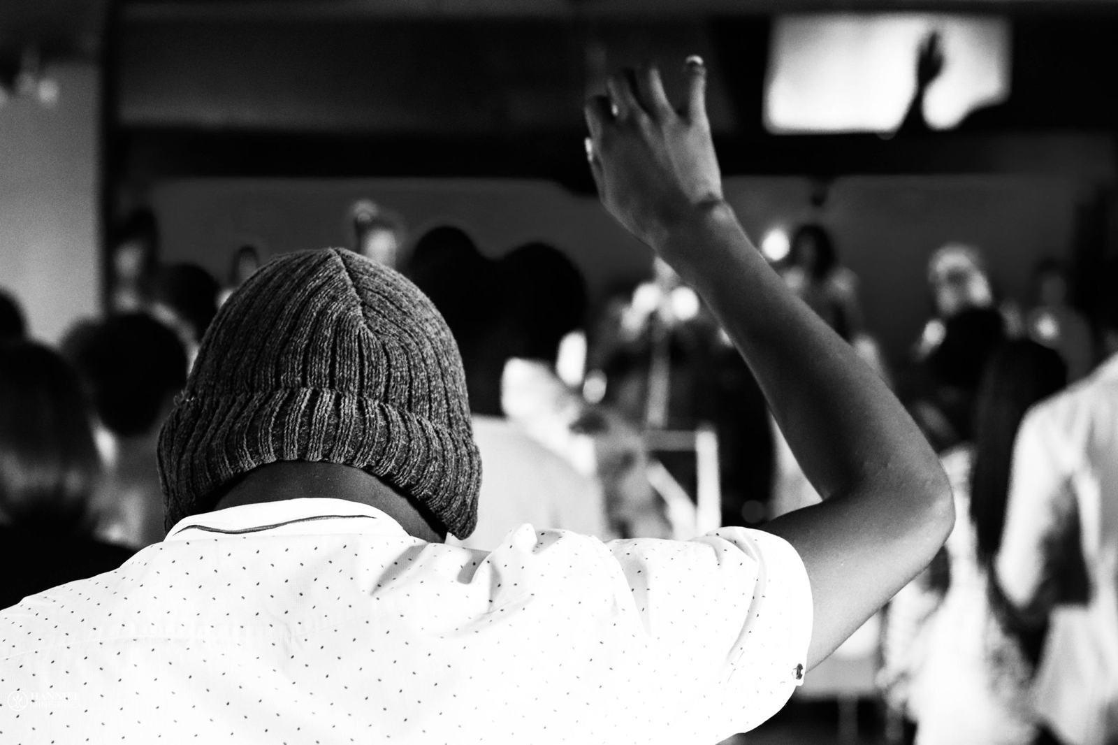 A person raising a hand in worship
